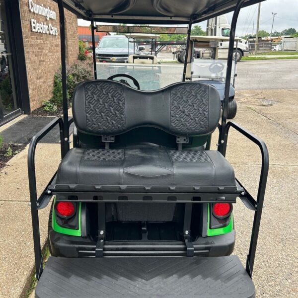 back of green golf cart